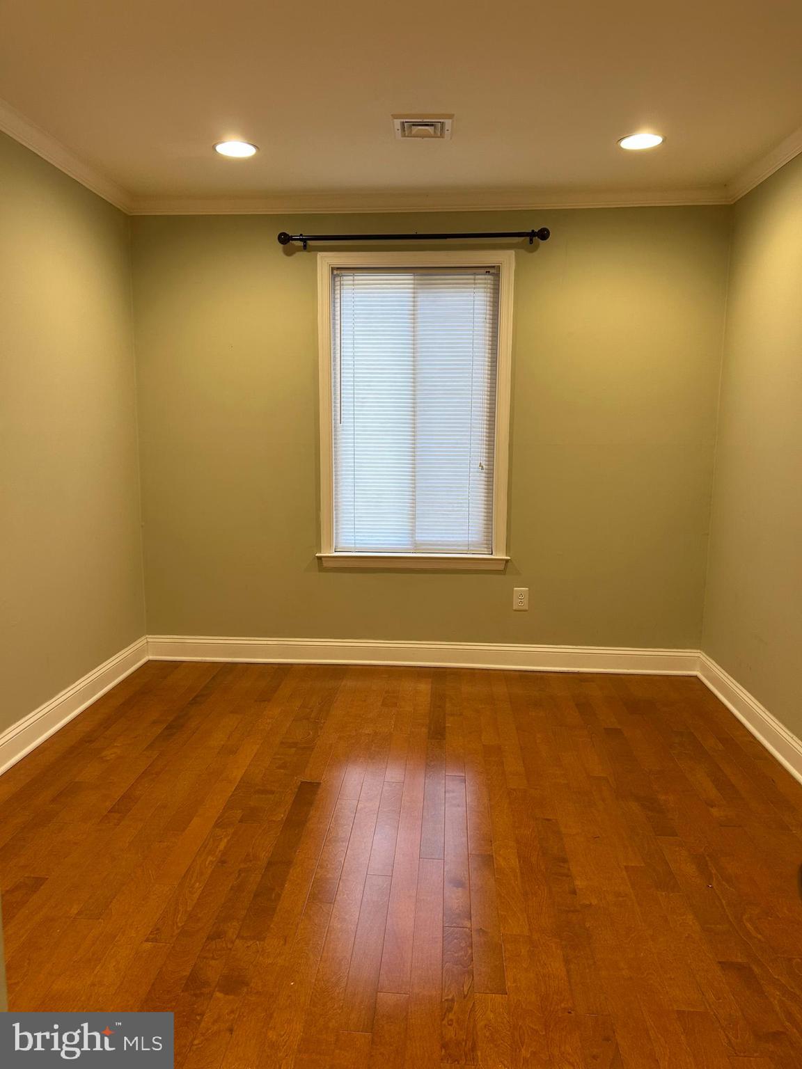 2-3 Aspen Way Doylestown, PA 18901 - Photo 17 of 18 an empty room with wooden floor and windows