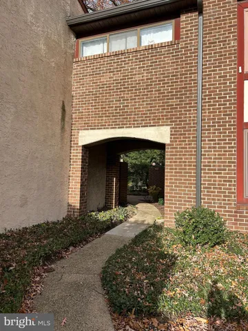 a view of a house with a small yard