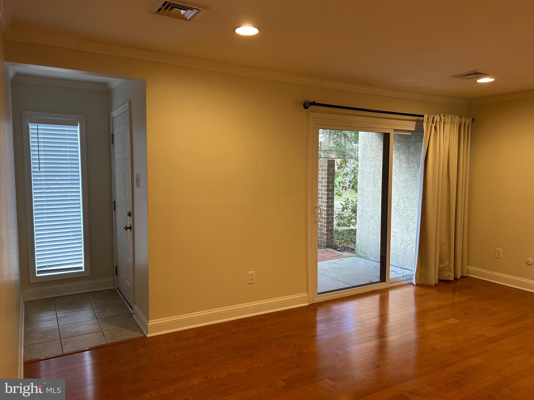 2-3 Aspen Way Doylestown, PA 18901 - Photo 7 of 18 an empty room with wooden floor and windows