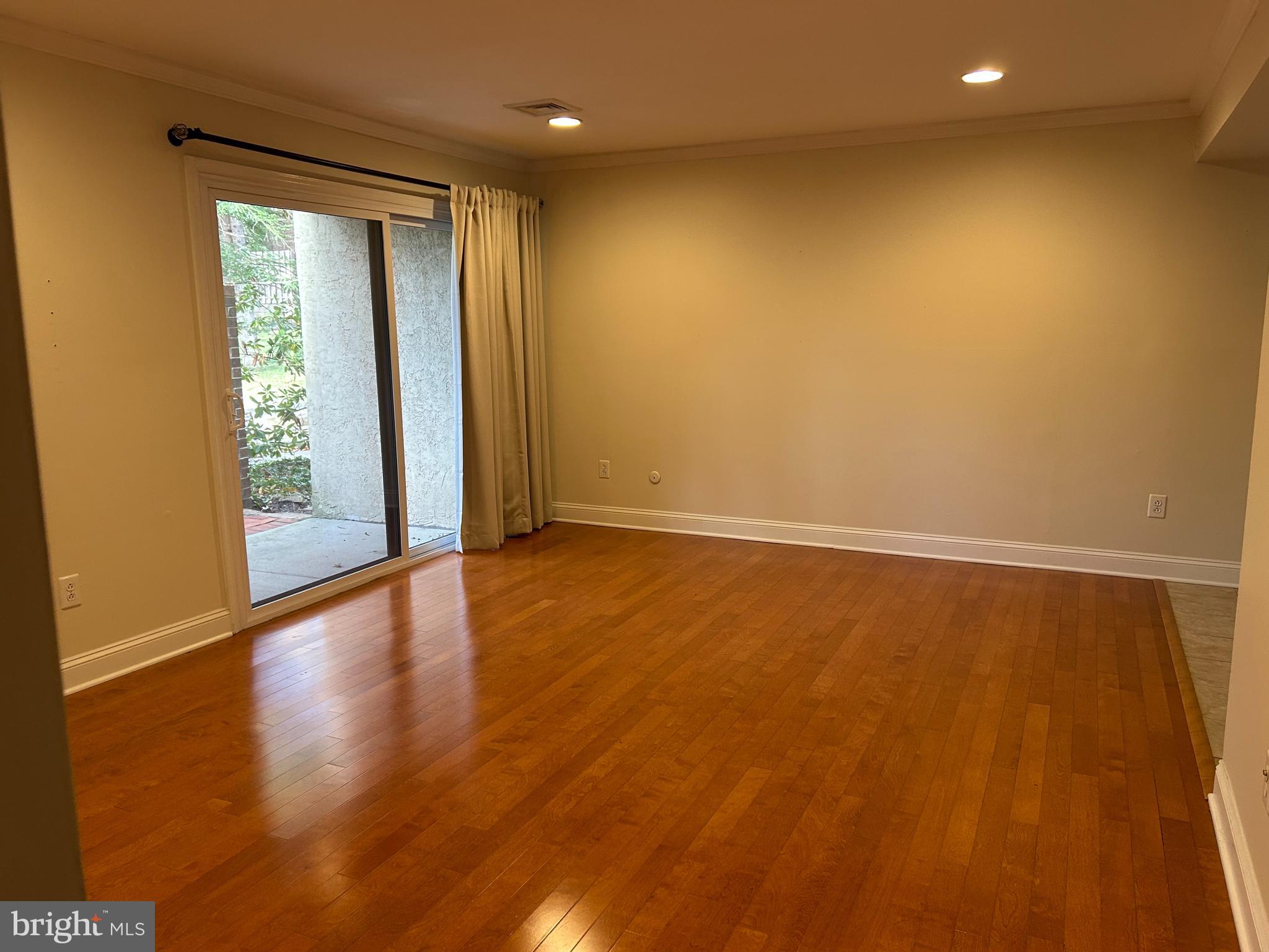 2-3 Aspen Way Doylestown, PA 18901 - Photo 8 of 18 an empty room with wooden floor and windows