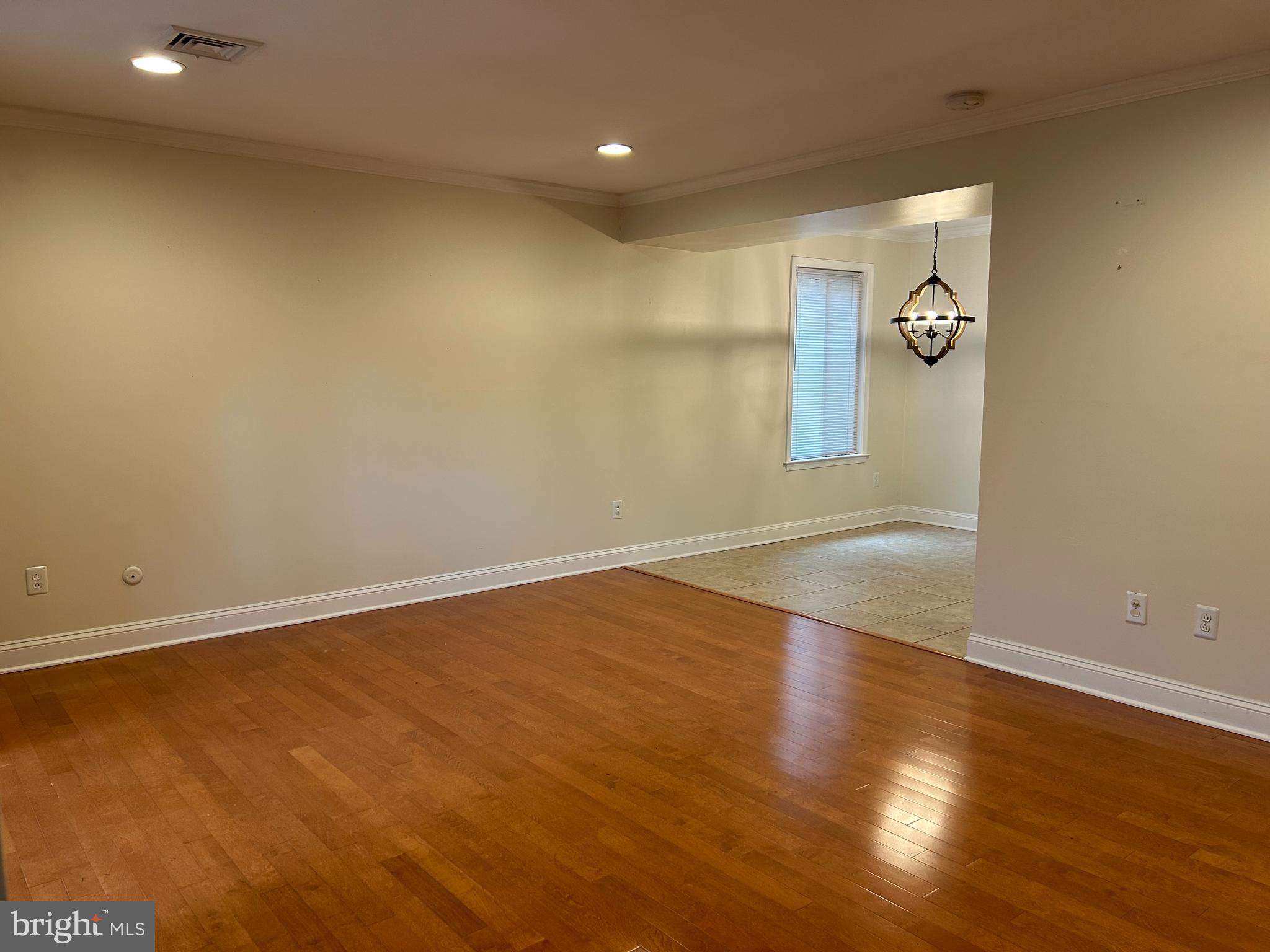 2-3 Aspen Way Doylestown, PA 18901 - Photo 9 of 18 an empty room with wooden floor and windows