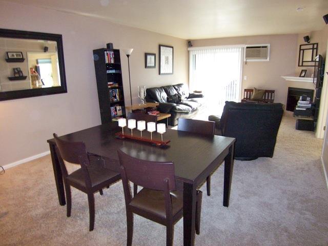 55 Mill Plain Road, Unit 336 Danbury, CT 06811 - Photo 1 of 1 a view of a dining room with furniture and a potted plant