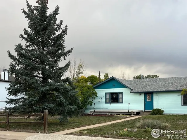 a view of house with yard