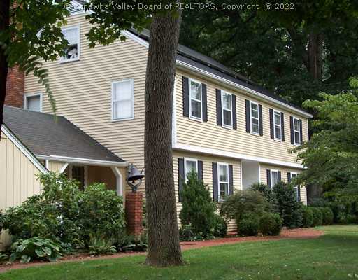 1603 Greystone Road Charleston, WV 25314 - Photo 1 of 16 Exterior Front. Authenic Colonial on Large Wooded Lot in Rolling Hills. Curved Brick Walkways are an inviting Feature of this Lovely Home.