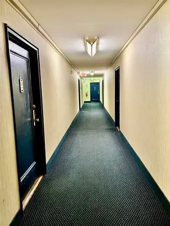 a room with lots of chairs and mirrors