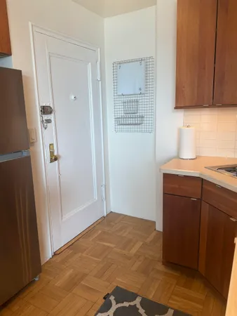 a kitchen with a sink and a refrigerator