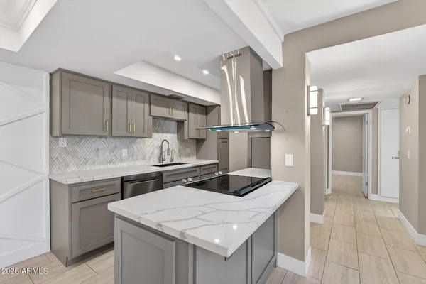 a kitchen with a sink a stove a refrigerator and cabinets