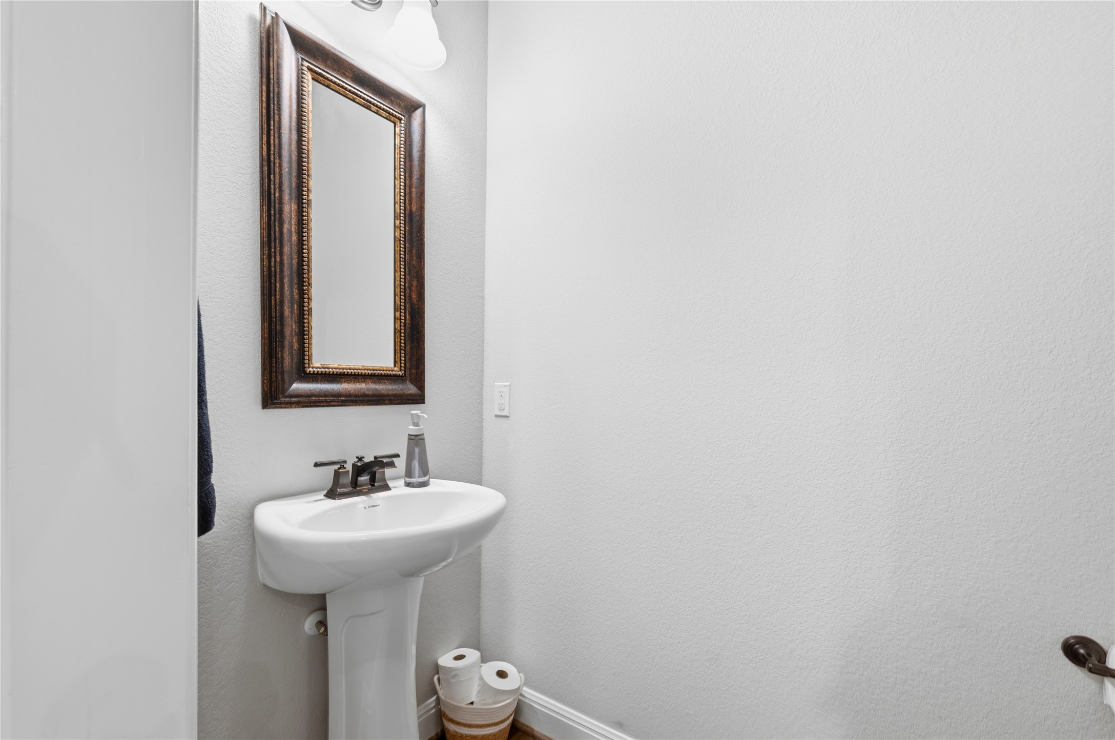 138 Rpd Spgs Cove Georgetown, TX 78628 - Photo 20 of 37 a bathroom with a sink and a mirror