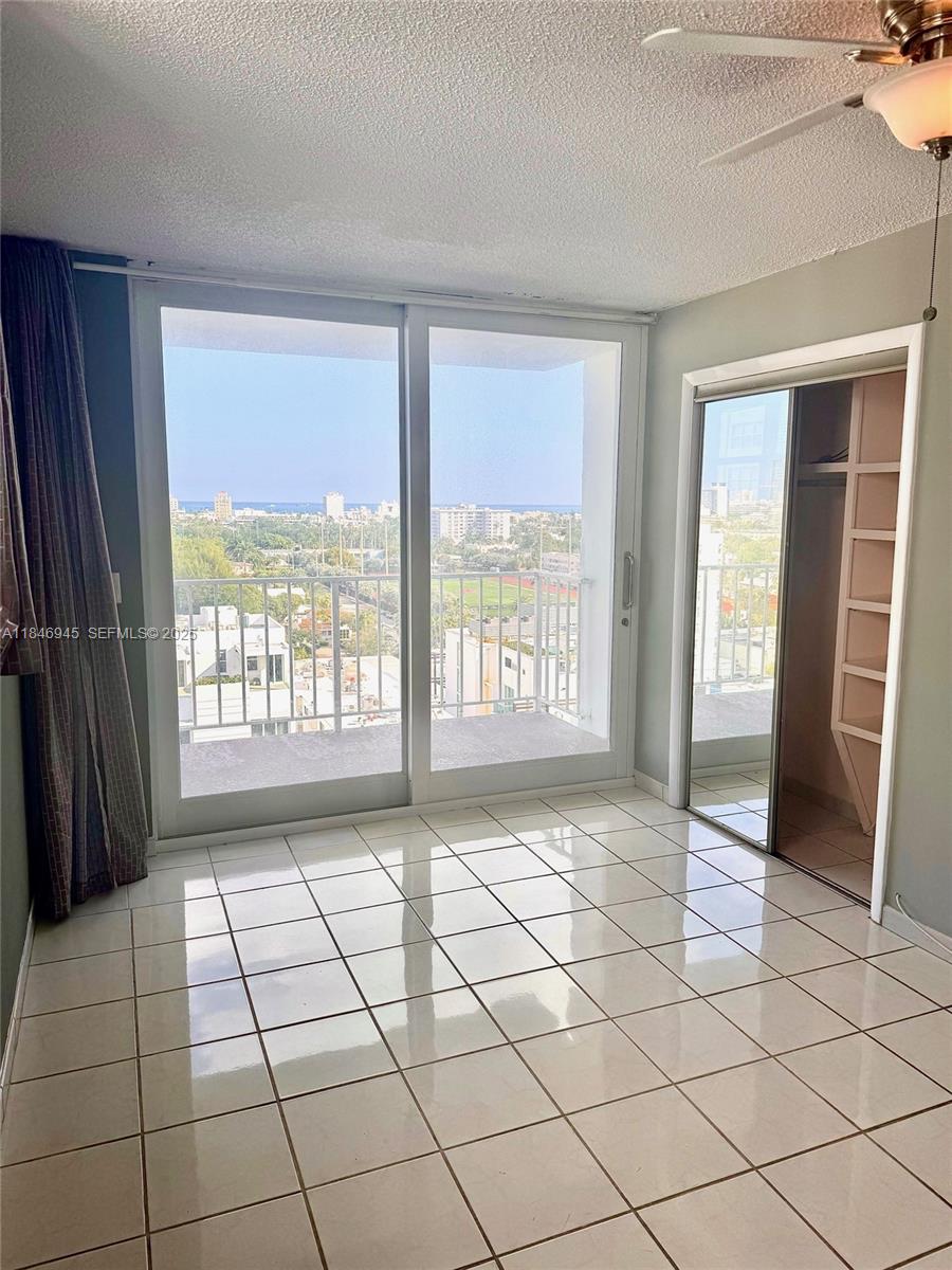 1228 West Avenue, Unit 1109 Miami Beach, FL 33139 - Photo 7 of 10 a view of an empty room and a window