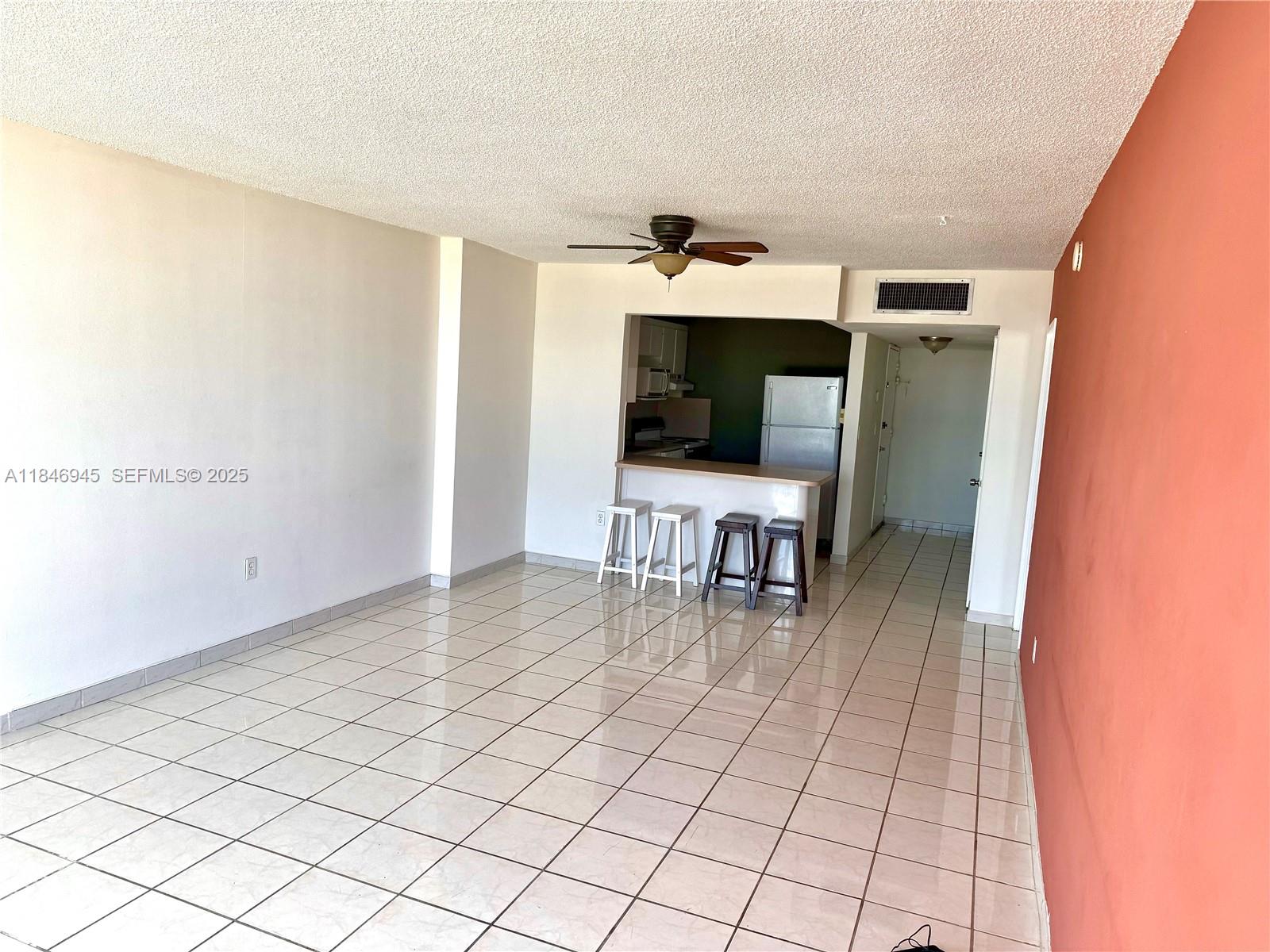 1228 West Avenue, Unit 1109 Miami Beach, FL 33139 - Photo 10 of 10 a living room with furniture and a fireplace