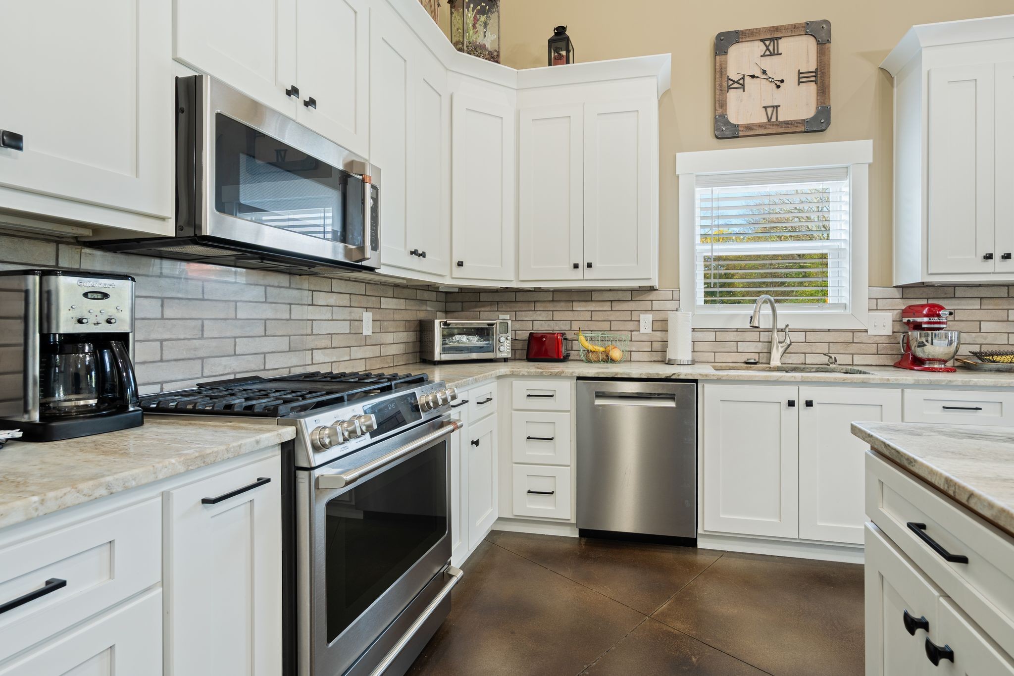 201 Graves Road Goodlettsville, TN 37072 - Photo 13 of 70 a kitchen with granite countertop white cabinets and white stainless steel appliances