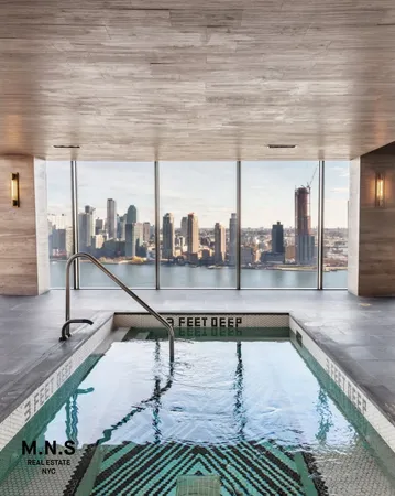 a swimming pool with view of water