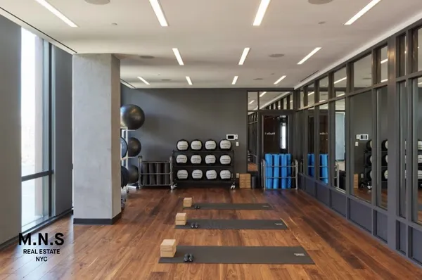 a view of gallery with wooden floor