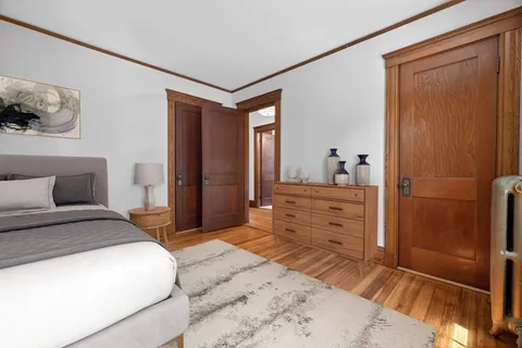 a bedroom with a bed and a dresser