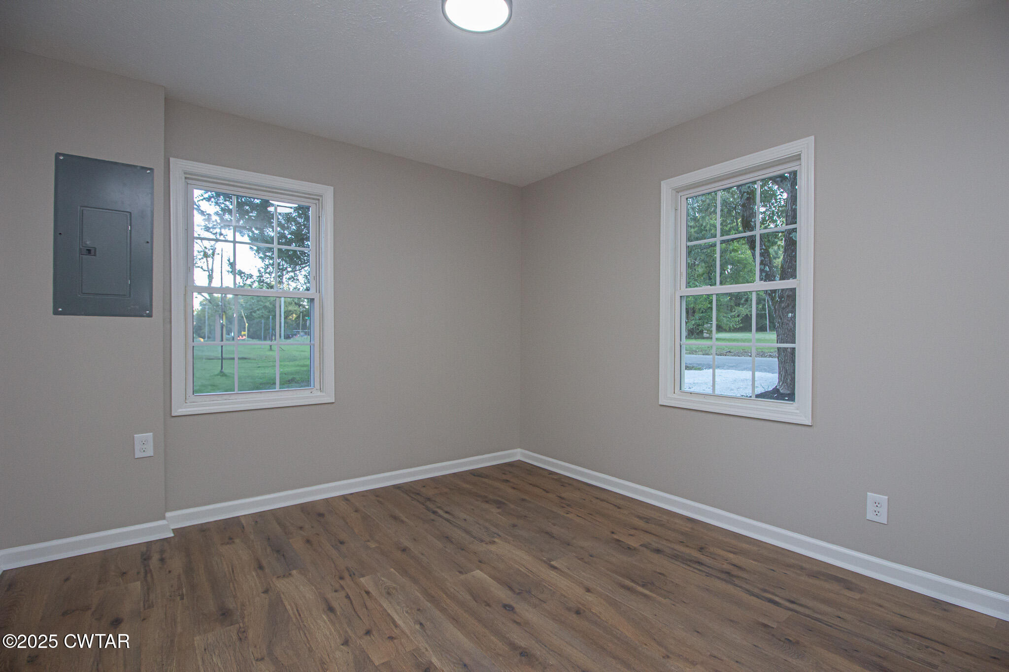 107 Lower Brownsville Road Jackson, TN 38301 - Photo 12 of 17 a view of an empty room with wooden floor and a window