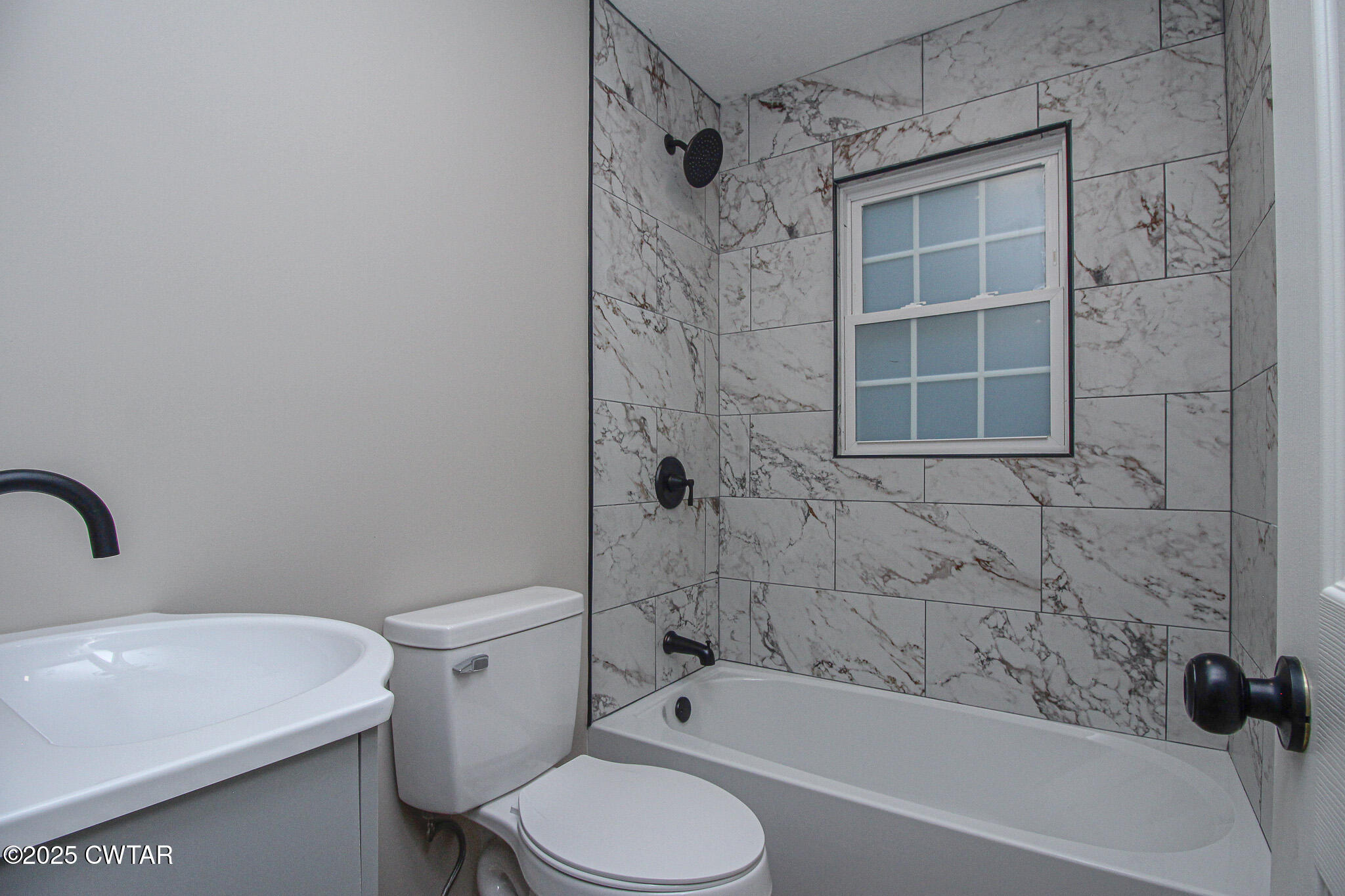 107 Lower Brownsville Road Jackson, TN 38301 - Photo 9 of 17 a bathroom with a toilet and shower