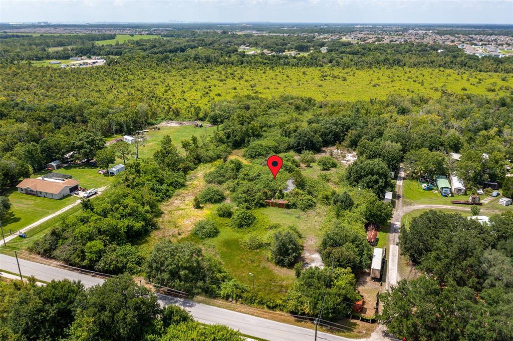 10800 Bill Tucker Road Wimauma, FL 33598 - Photo 1 of 9 a view of a city with mountains in the background