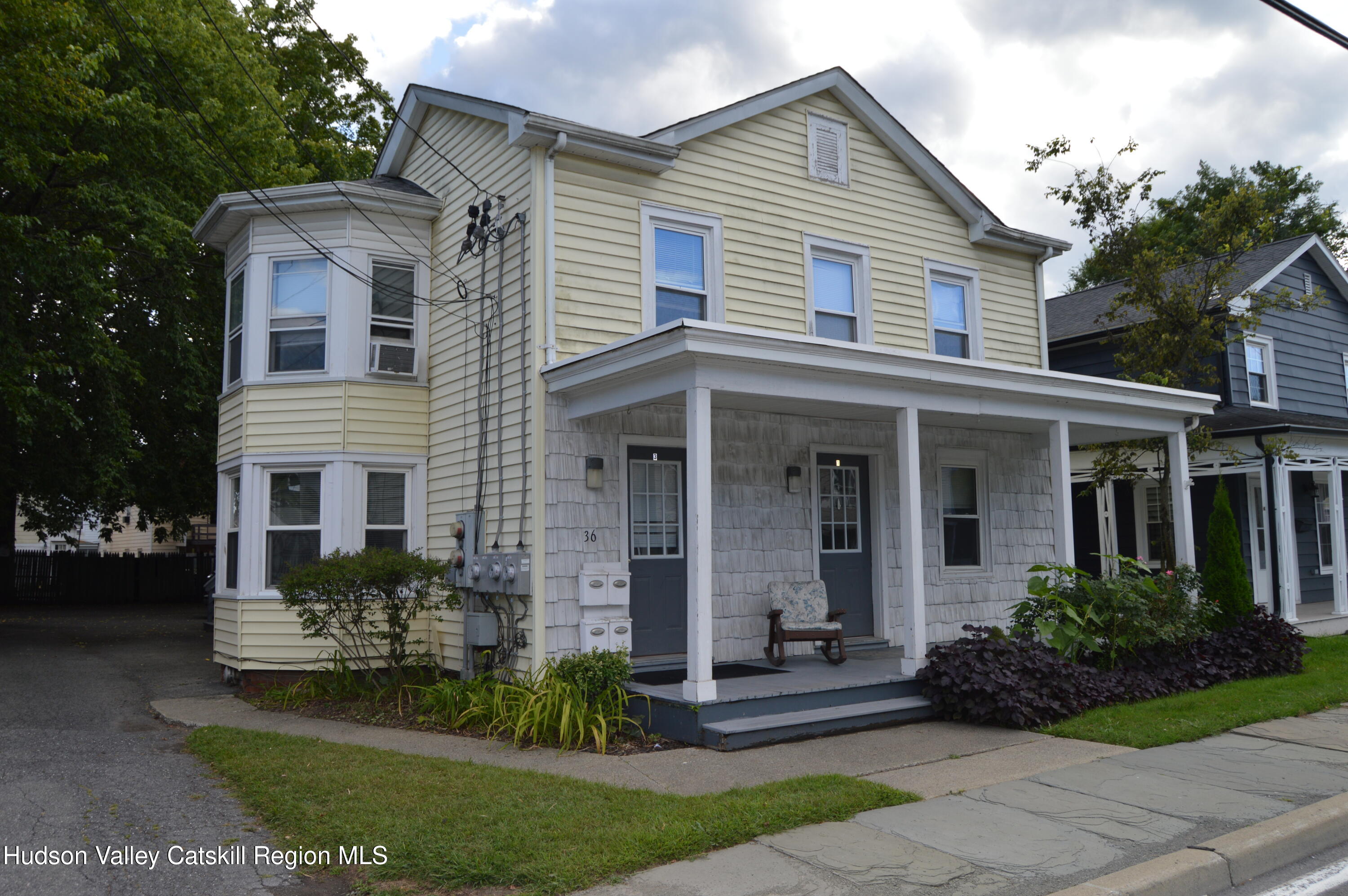 36 Ulster Avenue, Unit 2 Saugerties, NY 12477 - Photo 1 of 8 a front view of a house with a yard