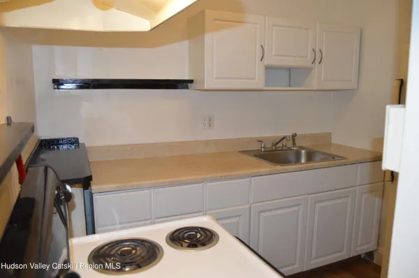 a kitchen with a sink and cabinets