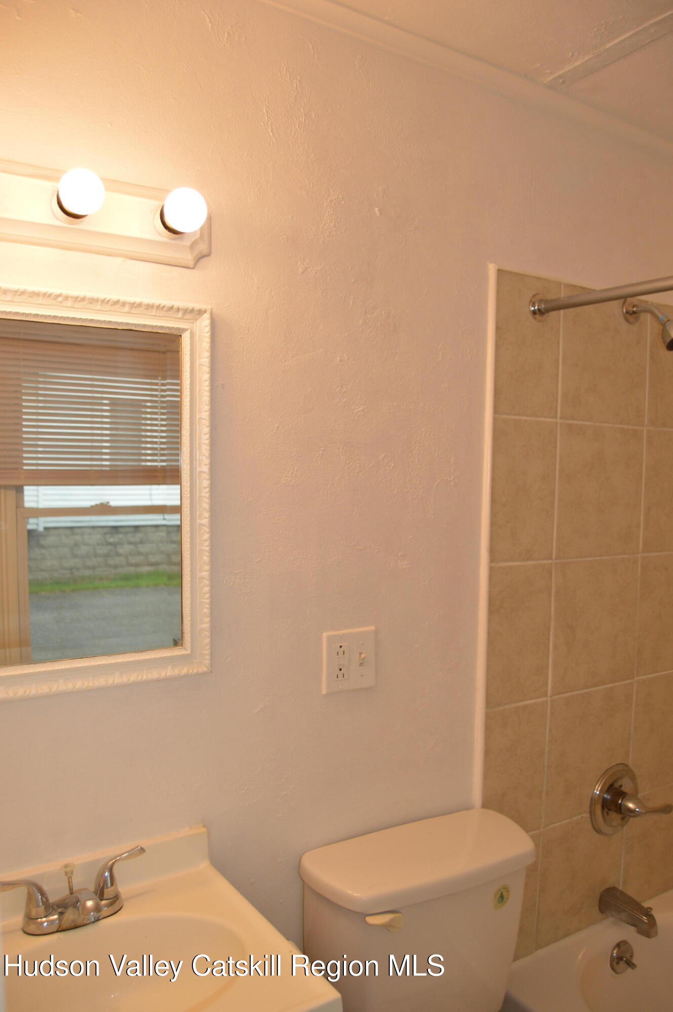 36 Ulster Avenue, Unit 2 Saugerties, NY 12477 - Photo 7 of 8 a bathroom with a toilet and a shower