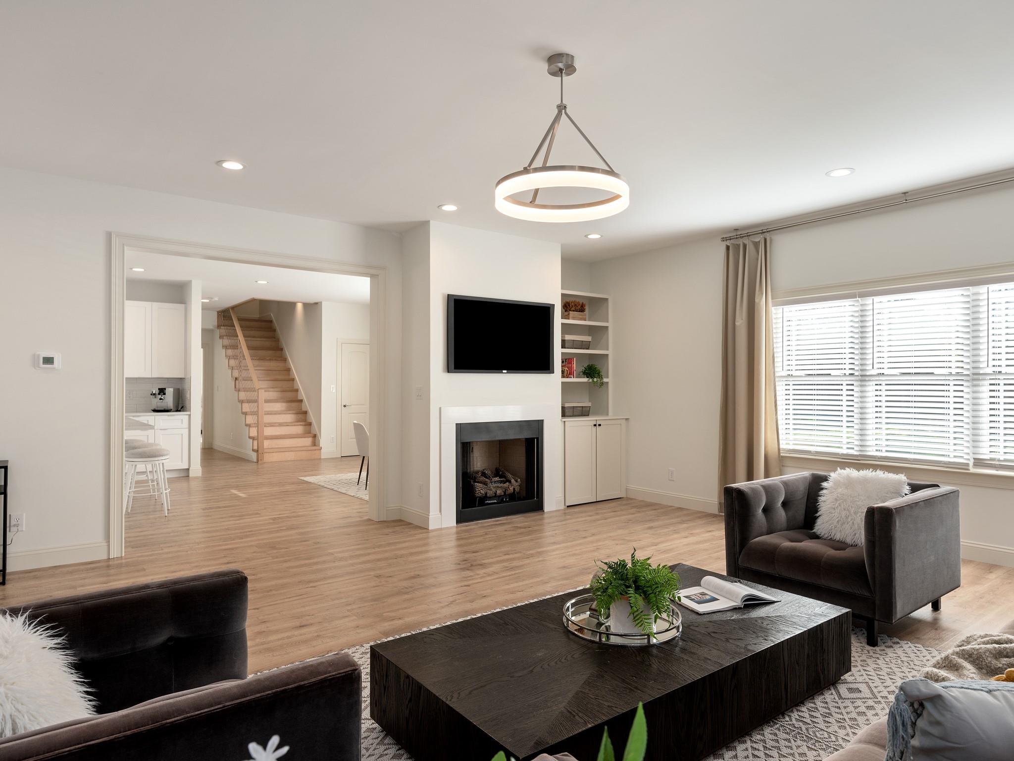 7417 New Town Road Waxhaw, NC 28173 - Photo 14 of 41 a living room with furniture a fireplace and a flat screen tv