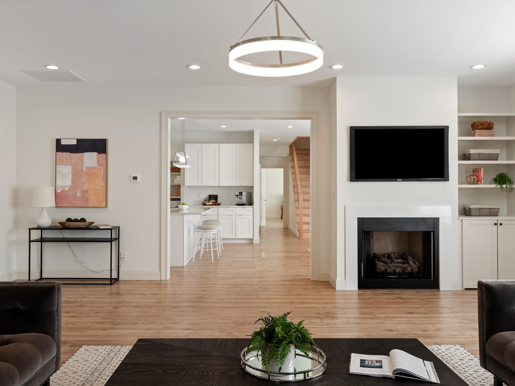 7417 New Town Road Waxhaw, NC 28173 - Photo 15 of 41 a living room with furniture a flat screen tv and a fireplace