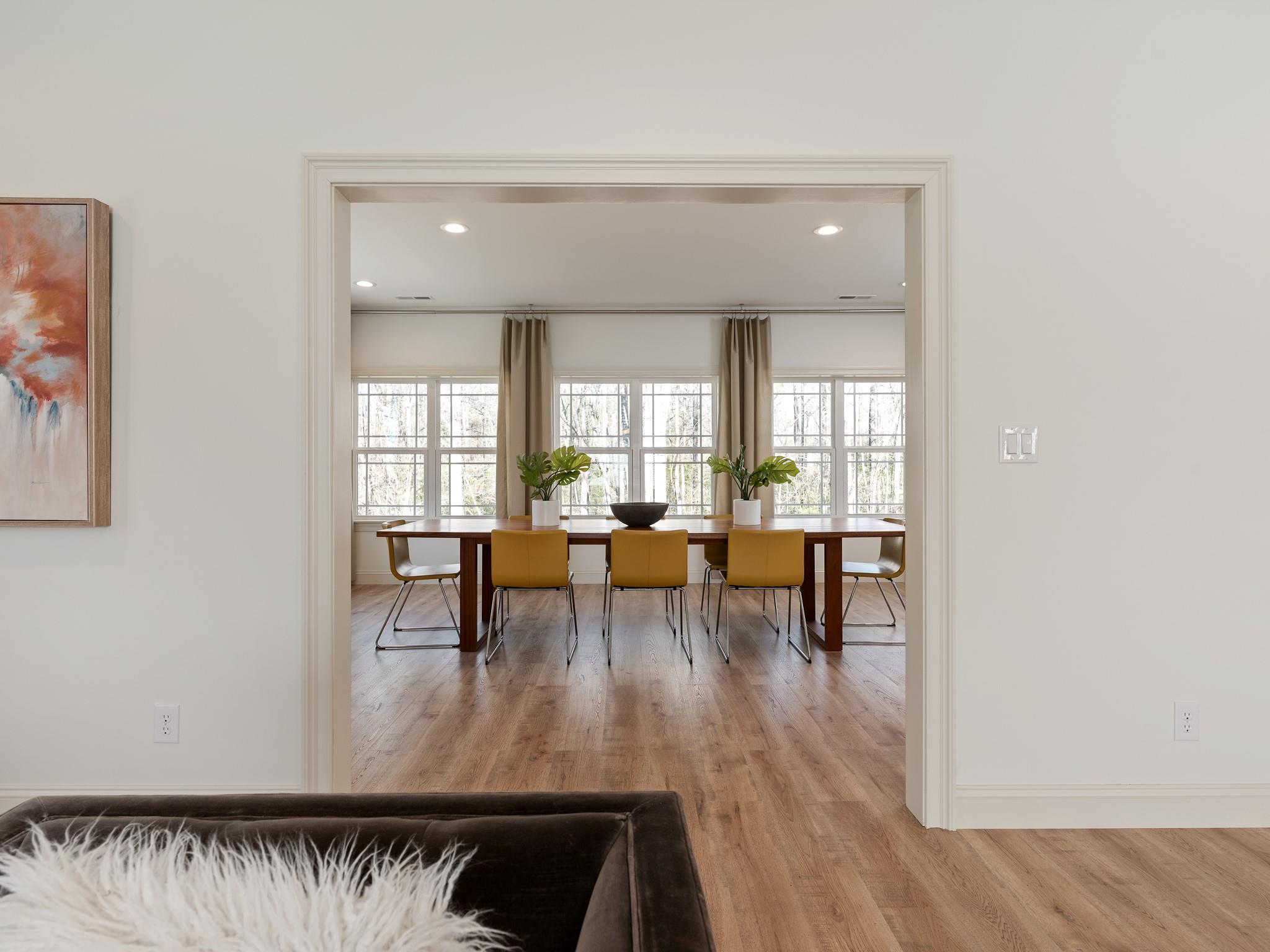 7417 New Town Road Waxhaw, NC 28173 - Photo 17 of 41 wooden floor with dining table and chairs