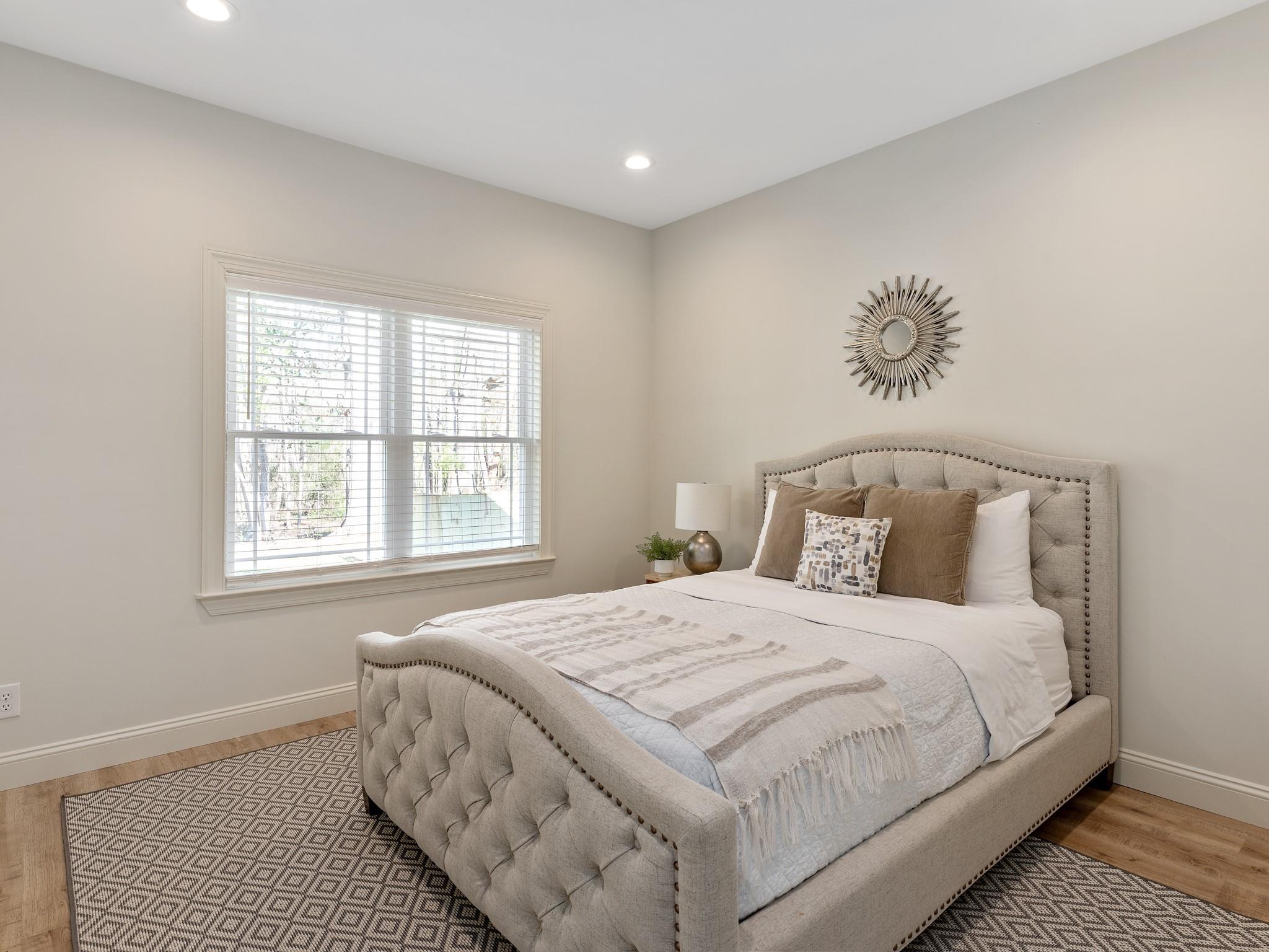 7417 New Town Road Waxhaw, NC 28173 - Photo 20 of 41 a bedroom with a large bed and a window