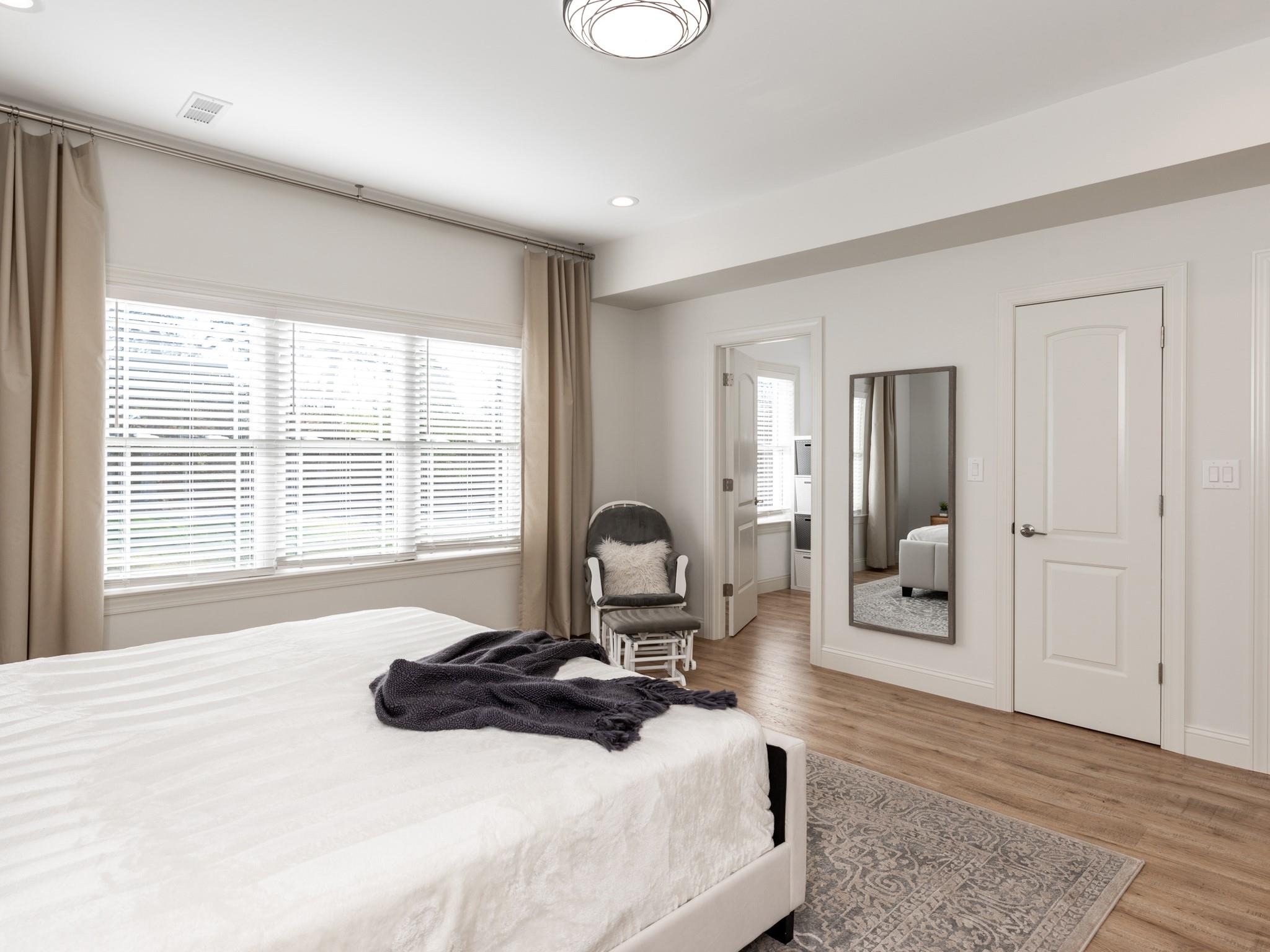 7417 New Town Road Waxhaw, NC 28173 - Photo 23 of 41 a bedroom with a bed and a large window