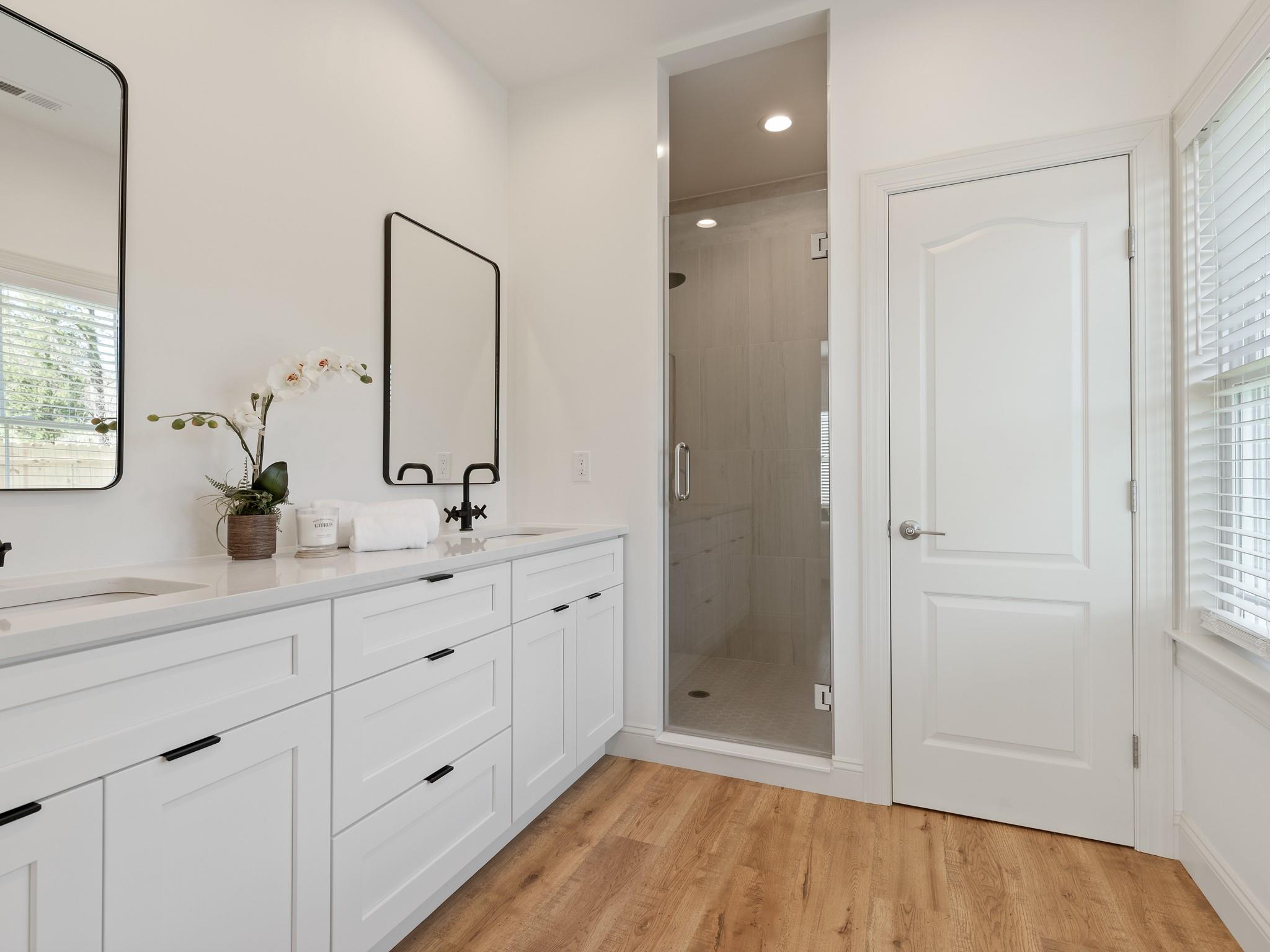 7417 New Town Road Waxhaw, NC 28173 - Photo 24 of 41 a bathroom with a double vanity sink and mirror