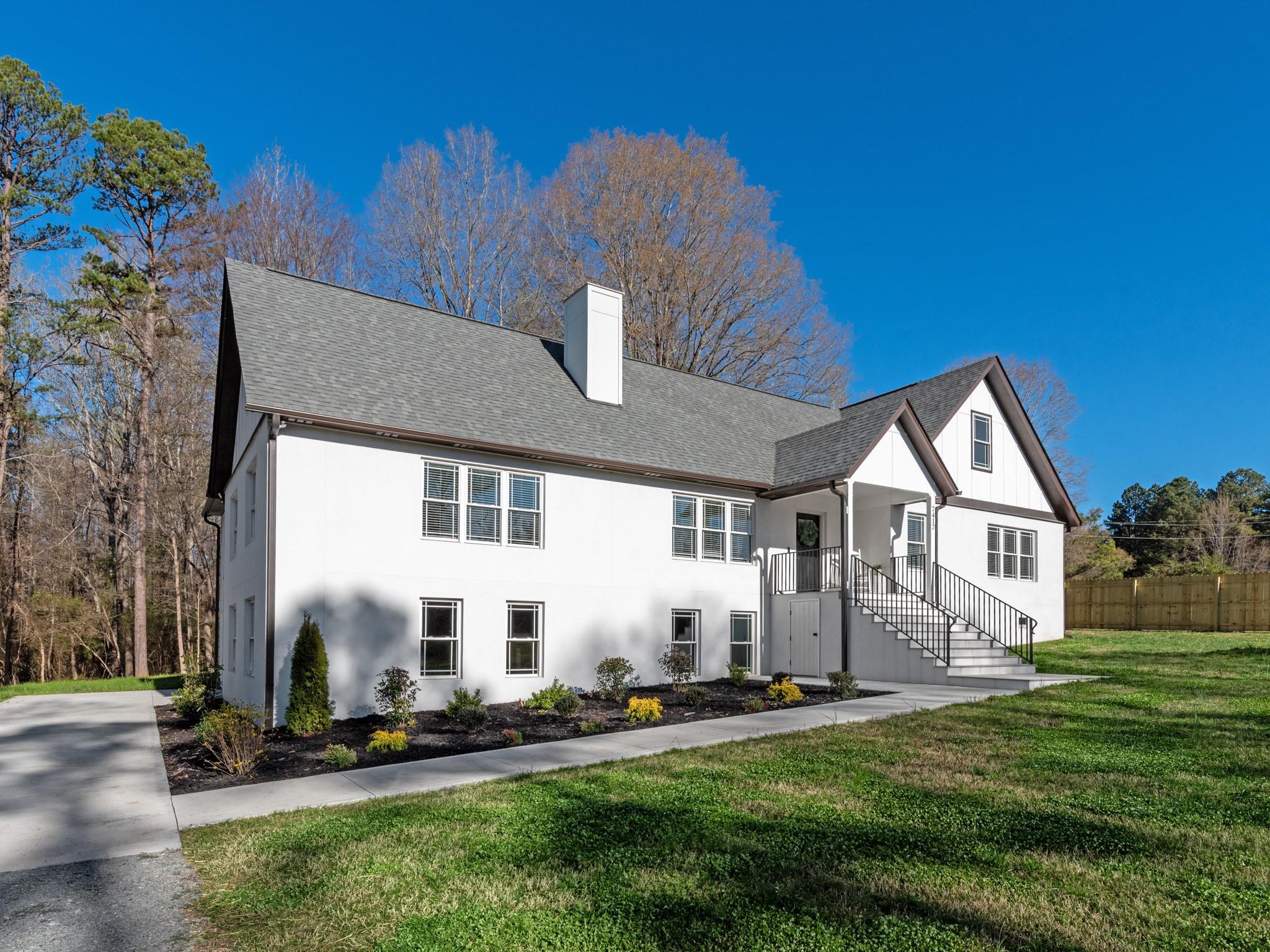7417 New Town Road Waxhaw, NC 28173 - Photo 3 of 41 a front view of a house with a yard
