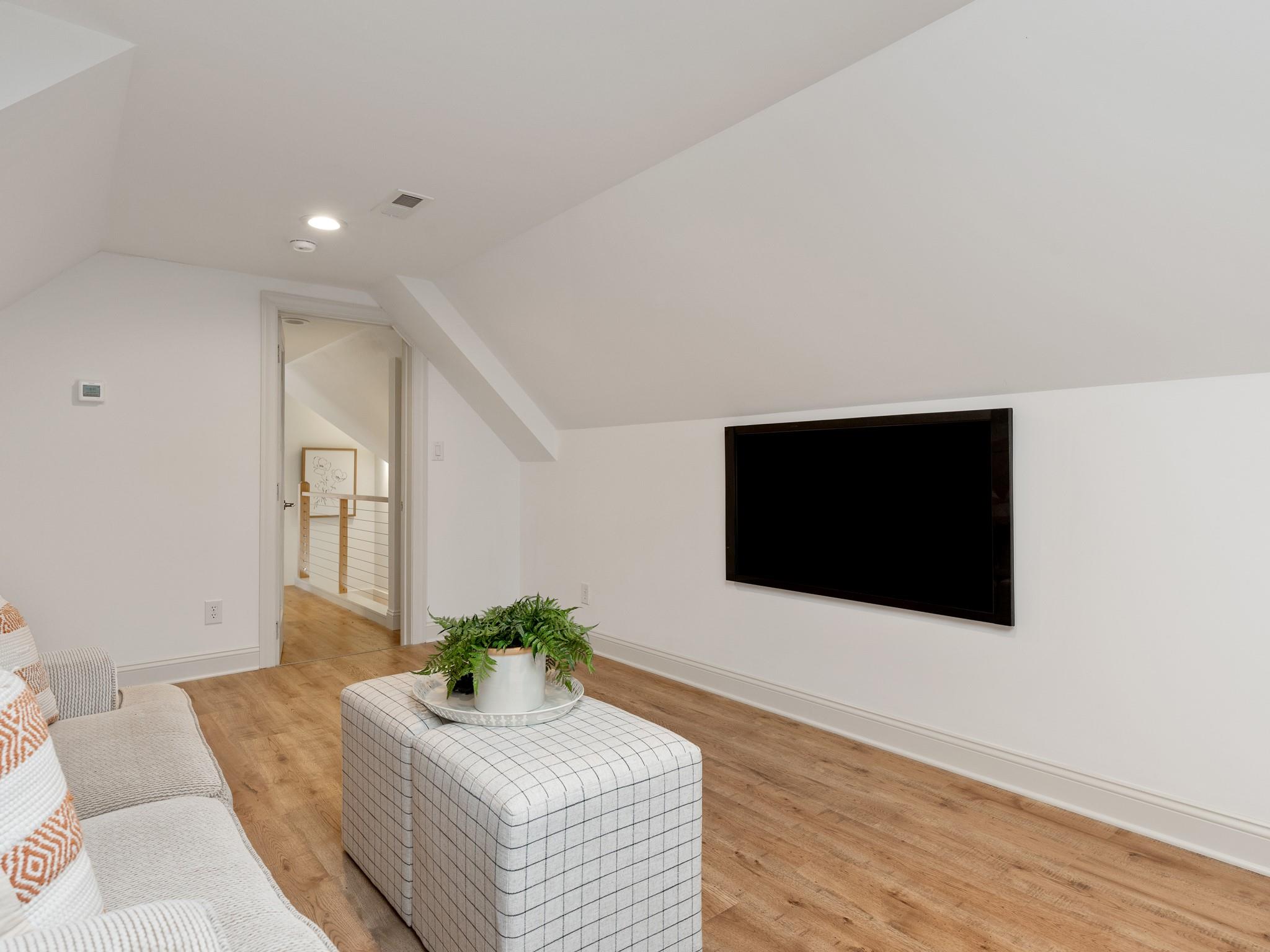 7417 New Town Road Waxhaw, NC 28173 - Photo 31 of 41 a living room with furniture and a flat screen tv