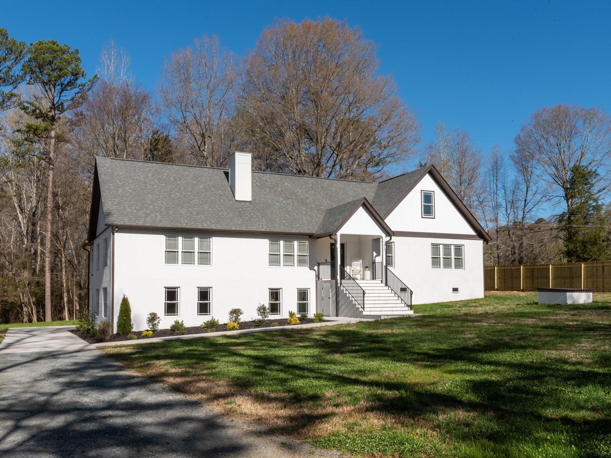 7417 New Town Road Waxhaw, NC 28173 - Photo 35 of 41 a front view of a house with a yard