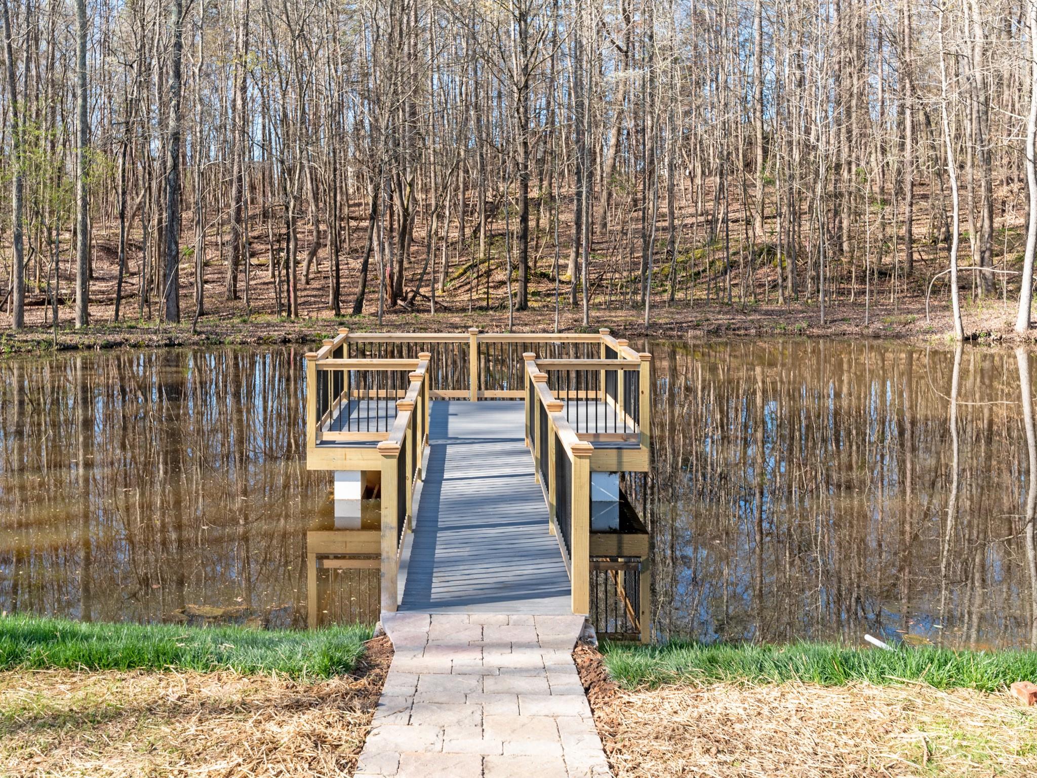 7417 New Town Road Waxhaw, NC 28173 - Photo 38 of 41 a front view of a building with wooden stairs