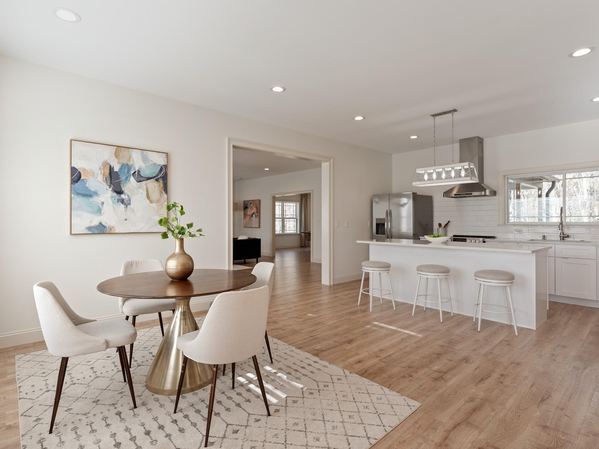 7417 New Town Road Waxhaw, NC 28173 - Photo 5 of 41 a view of a dining room with furniture