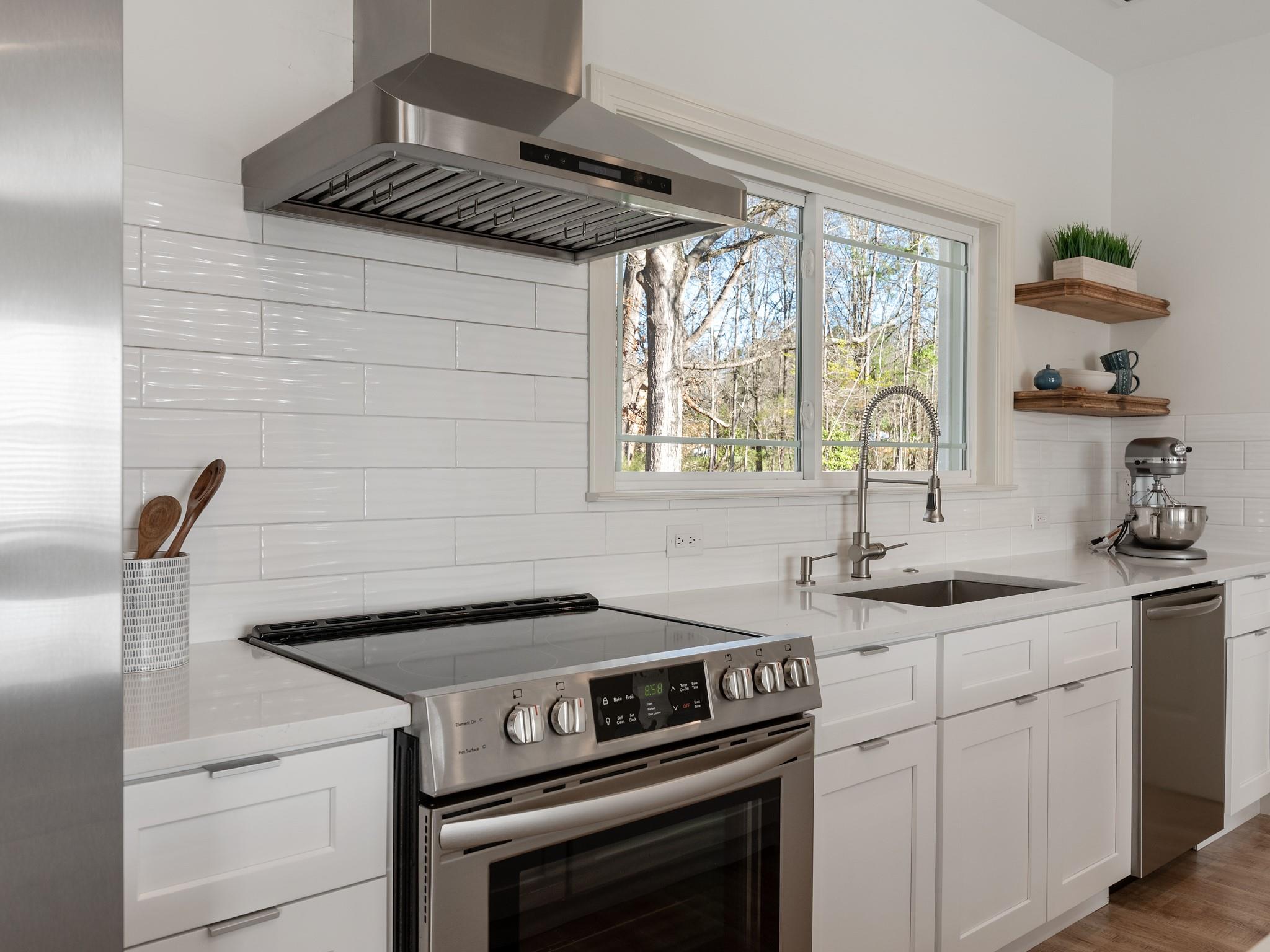 7417 New Town Road Waxhaw, NC 28173 - Photo 10 of 41 a kitchen with a stove and a sink