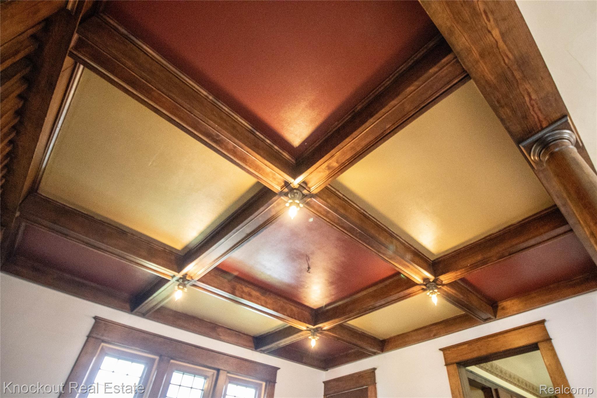 19983 West Ridge Road Henderson, MI 48841 - Photo 17 of 76 Coffered ceiling featuring rich wood beams, recessed panels in warm tones, and integrated lighting fixtures
