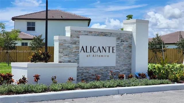 front view of a house with potted plants