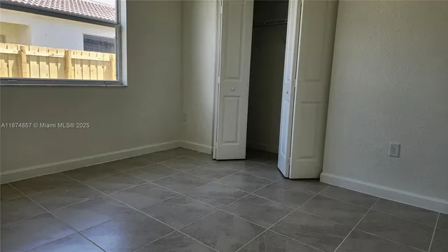 a view of a room that has a window in it