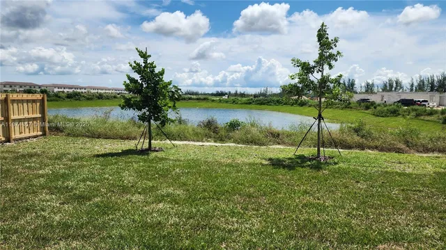 a view of a garden with a lake