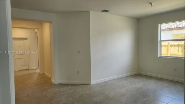 a view of an empty room and window