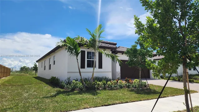a house that has a tree in front of it