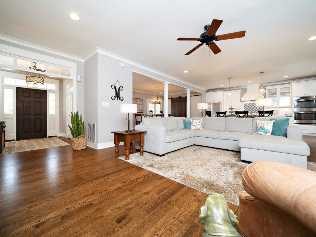 2516 Mt Vernon Church Road Raleigh, NC 27614 - Photo 12 of 58 a living room with furniture kitchen view and a wooden floor
