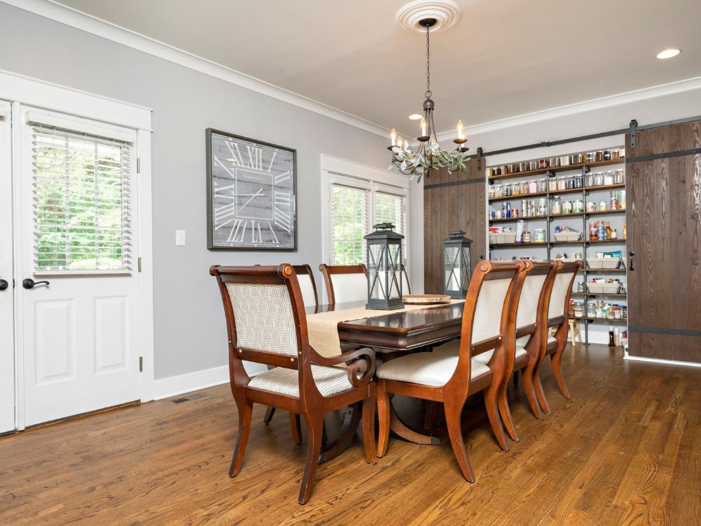 2516 Mt Vernon Church Road Raleigh, NC 27614 - Photo 13 of 58 a dining room with furniture a chandelier and wooden floor