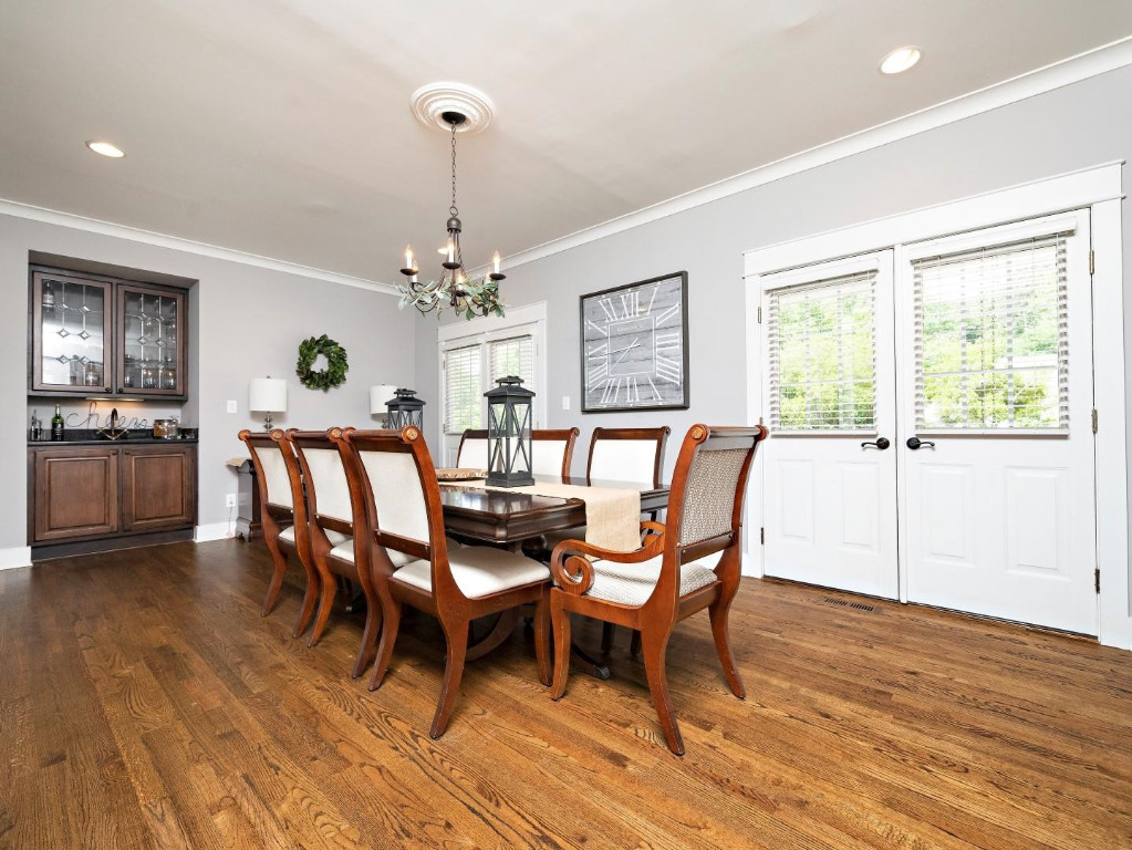2516 Mt Vernon Church Road Raleigh, NC 27614 - Photo 14 of 58 a dining room with furniture a chandelier and wooden floor