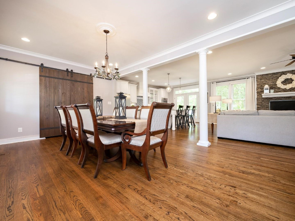 2516 Mt Vernon Church Road Raleigh, NC 27614 - Photo 17 of 58 a view of a dining room with furniture and chandelier