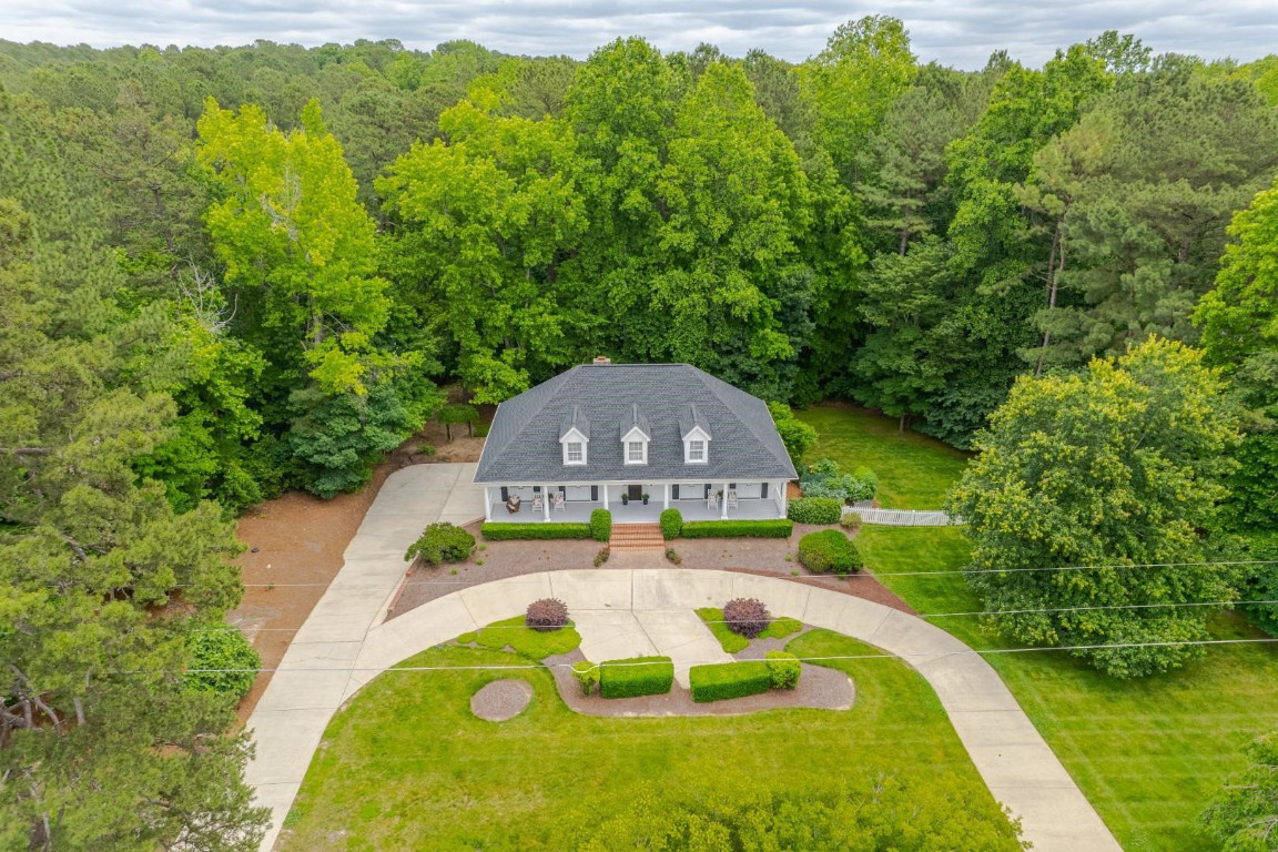 2516 Mt Vernon Church Road Raleigh, NC 27614 - Photo 2 of 58 a swimming pool with trees in the background