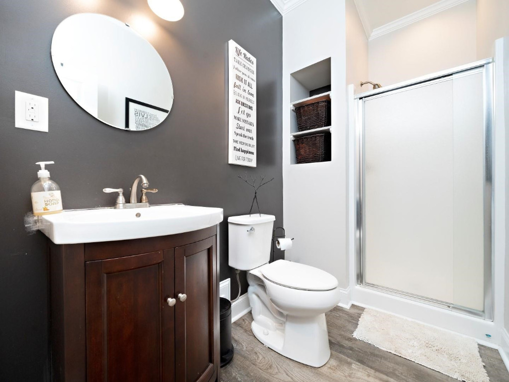 2516 Mt Vernon Church Road Raleigh, NC 27614 - Photo 26 of 58 a bathroom with a sink toilet and mirror