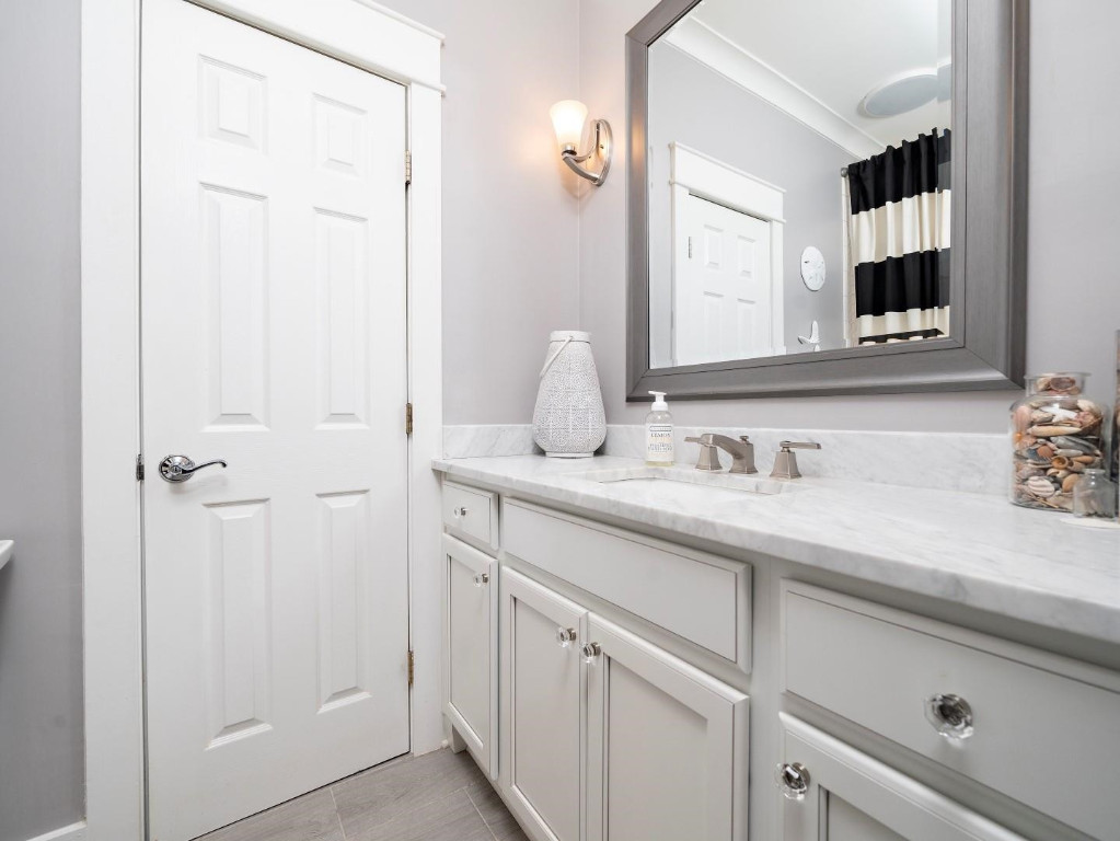 2516 Mt Vernon Church Road Raleigh, NC 27614 - Photo 31 of 58 a bathroom with a sink and a mirror