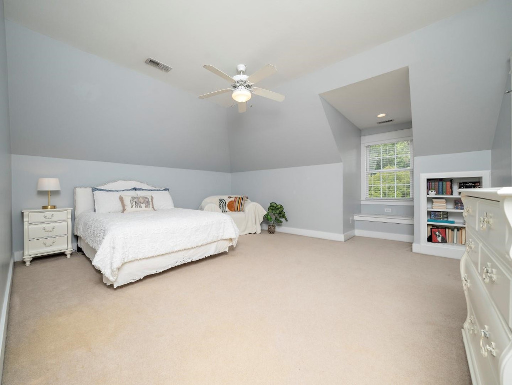2516 Mt Vernon Church Road Raleigh, NC 27614 - Photo 37 of 58 a bedroom with a bed and a ceiling fan